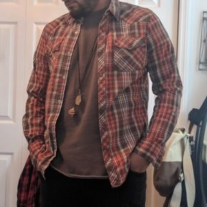 7 flannels. Size Medium.